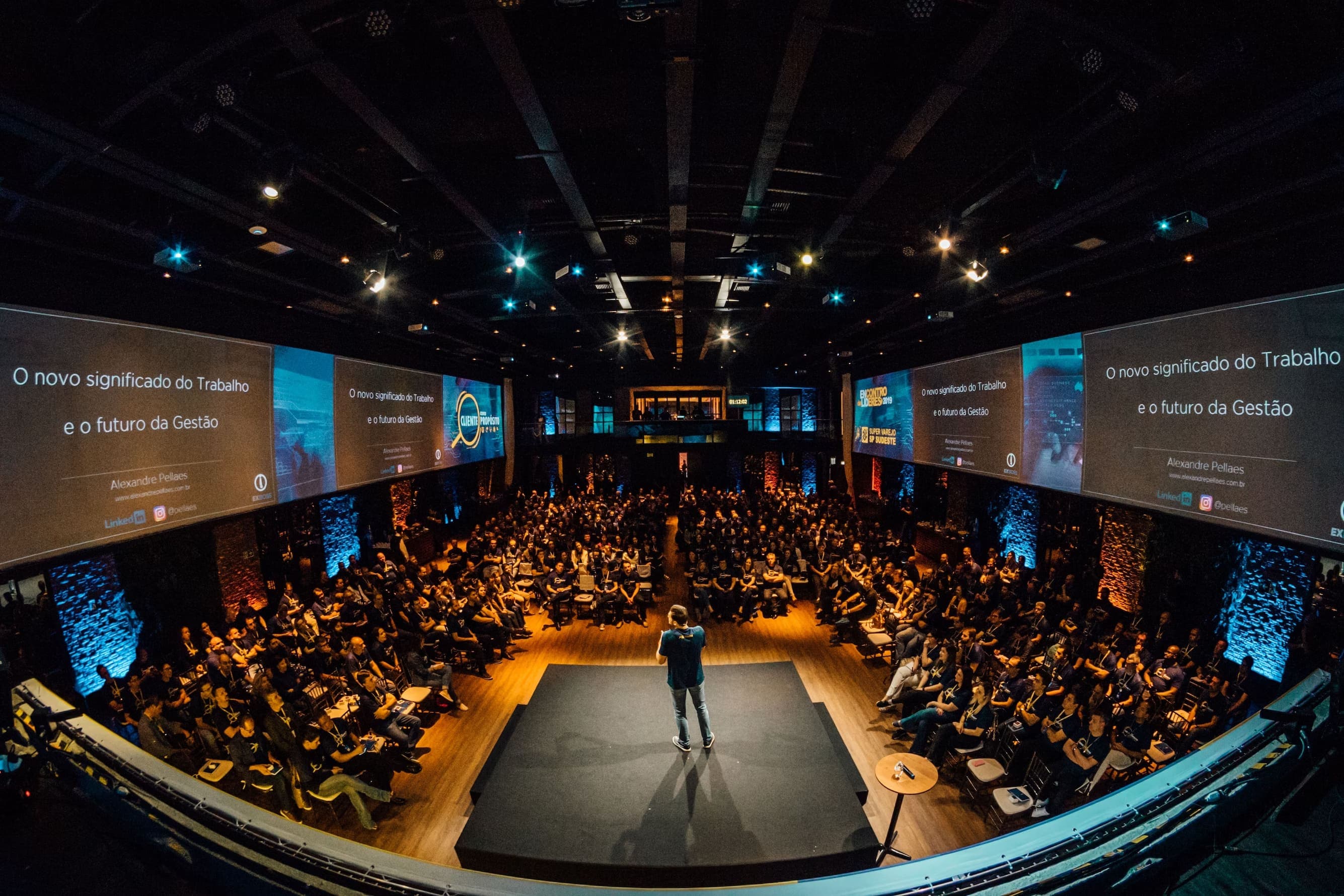 Full auditorium during a conference presentation
